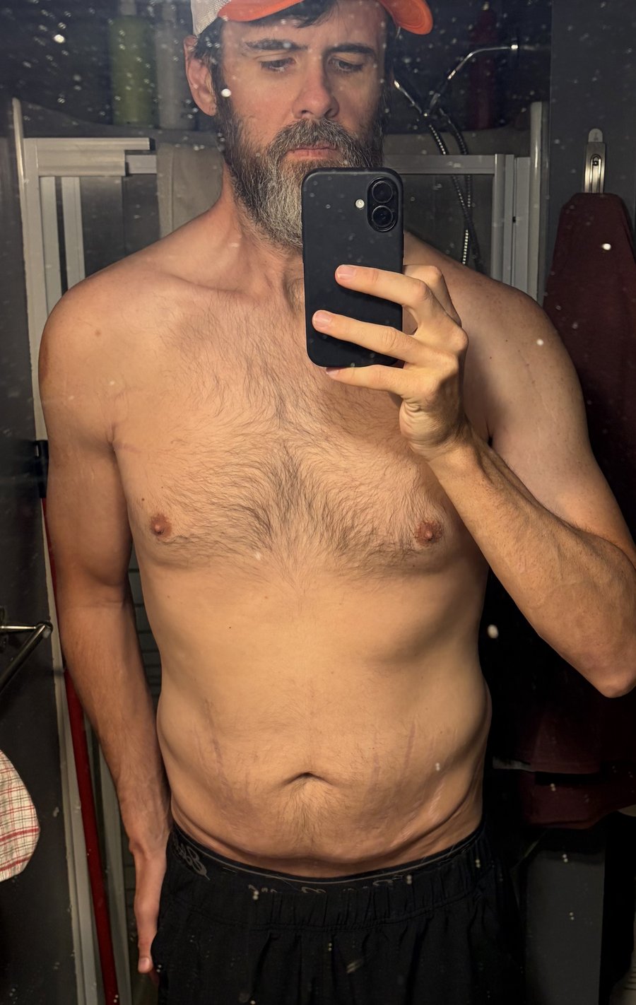 Tyler Brown, starting-point mirror photo at 198 pounds, week one of a MOTS-c protocol, July 2026